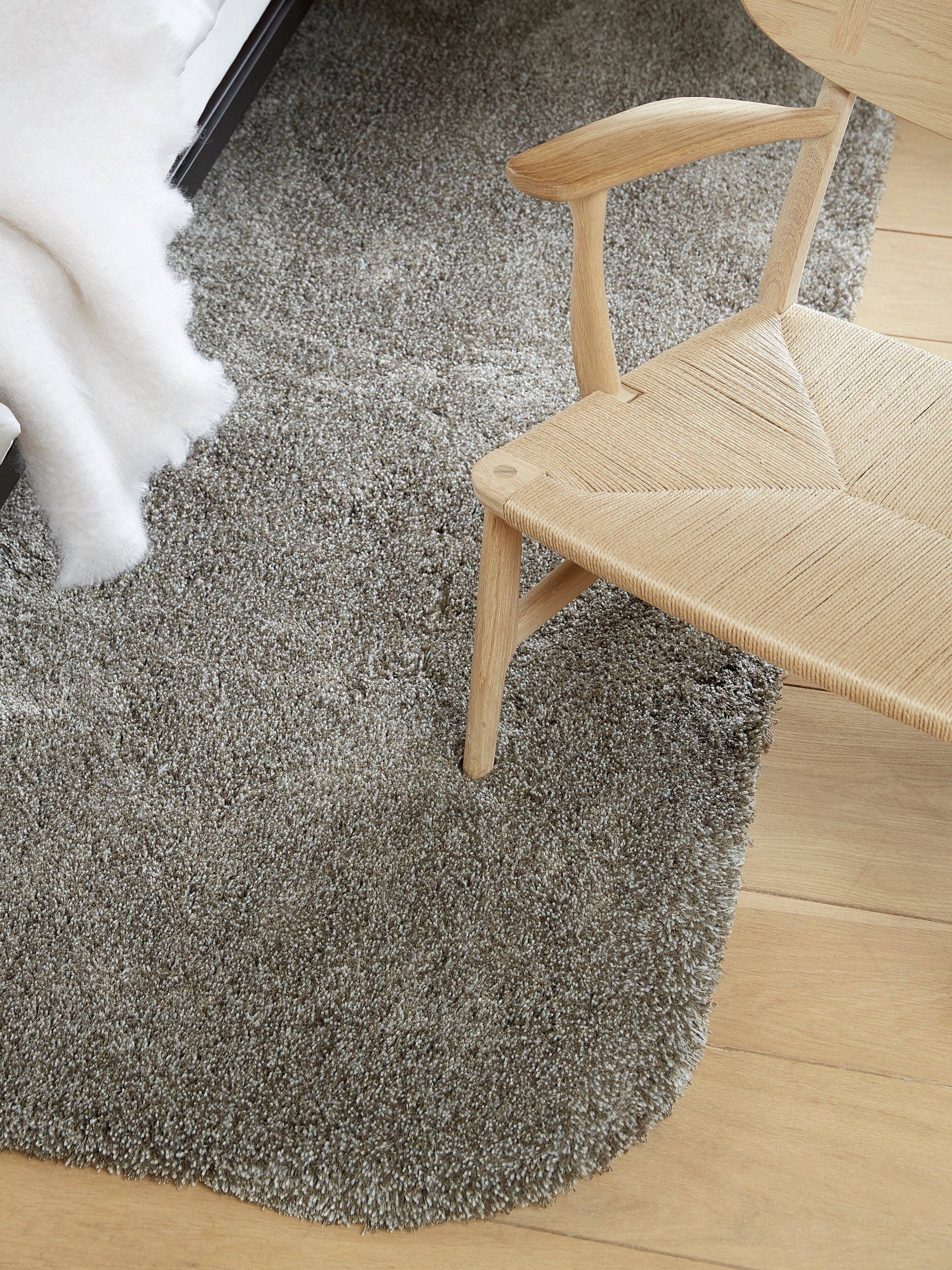 Detail of At Ease rug in grey showing eucalyptus and wool. 35 mm pile