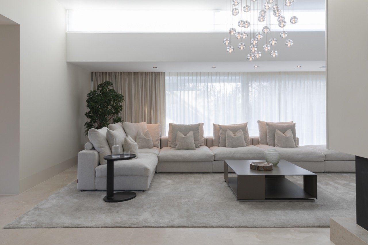 Living room with Move Slow rug in soft grey eucalyptus yarn